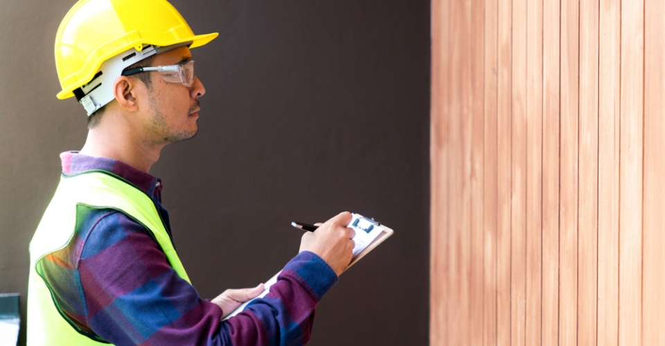technician checking home in energy audit