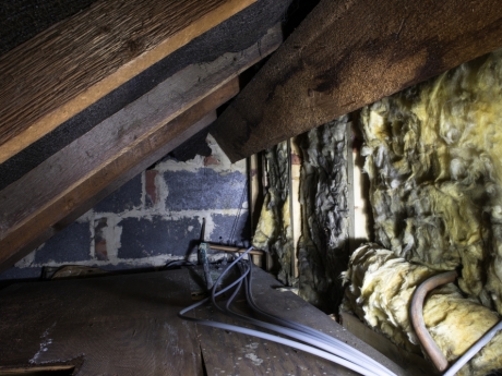 old insulation in attic of house