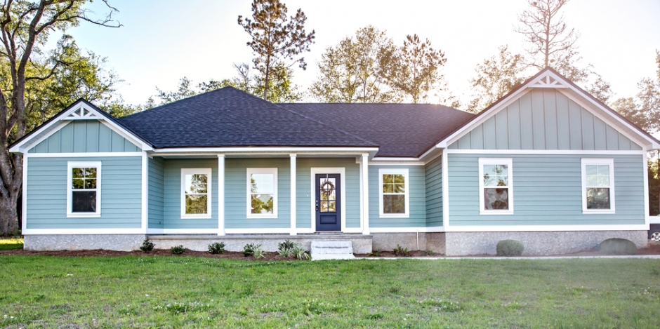 front view of a one story blue house